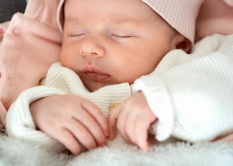 Sleeping Newborn with Tiny Hands Фото