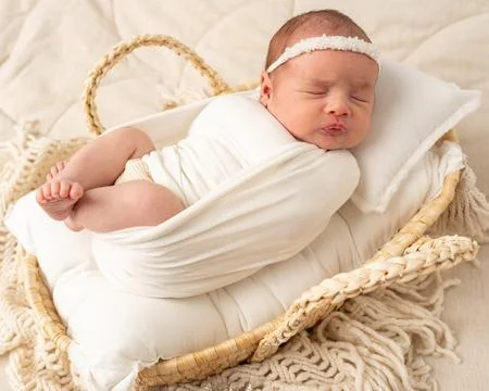 Sleeping newborn wrapped in soft textiles Stock-Fotos