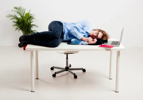 Sleeping in the office Stock Photos