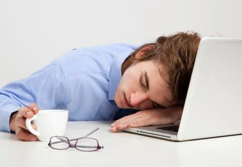 Sleeping over the laptop Stock Photos