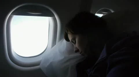 Sleeping on a plane Video stock 11844031
