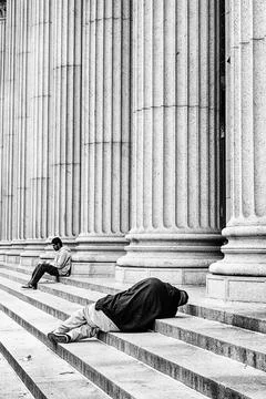 Sleeping On the Post Office Steps Stock Photos