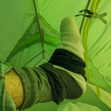 Sleeping in a tent with multiple layer socks Foto stock
