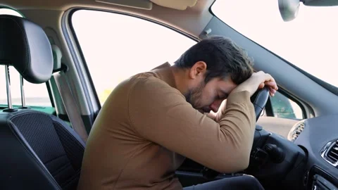 A sleeping tired driver stopped on the side of the road to rest. Lie down on Stock-Footage 300255931