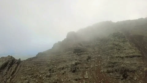 Sleeping volcanic crater with the coming down fog aerial footage Stock Footage 85026632