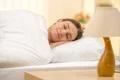 The sleeping woman on the background of a bedside table Photo