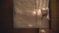 The sleeping woman lay on the bed. View from above 4k or 4k+ Resolution