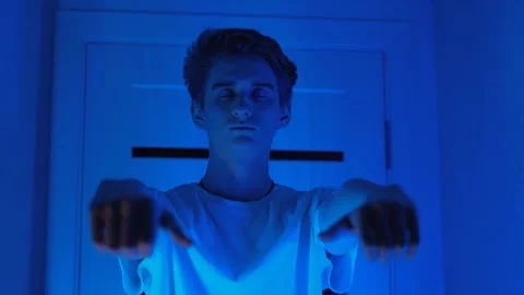 Sleeping young man walking around the room at night Video stock 270973265