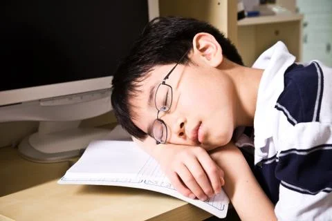 Sleeping young student Stock Photos
