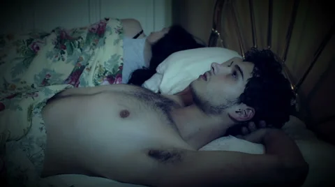 A sleepless man for his problems is comforted by his wife Stock Footage 28504888