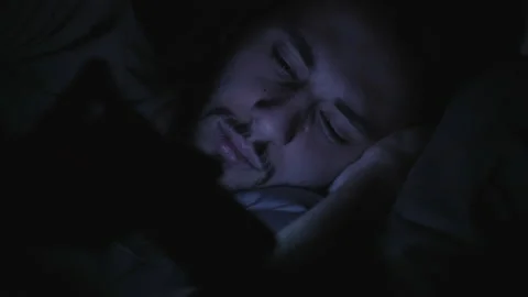 Sleepless night screen time man watching phone Stock Footage 132003465