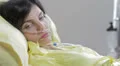 sleepy and sad woman in a bed of the hospital for lung cancer HD Footage