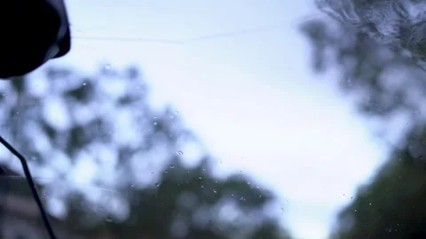 Sleepy car passanger view looking up at rainy windshield Stock Footage 273675196