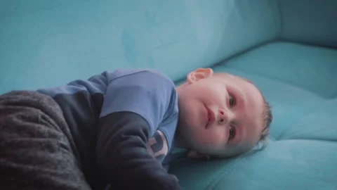 Sleepy Child Lying on a Sofa Stock Footage 199659103