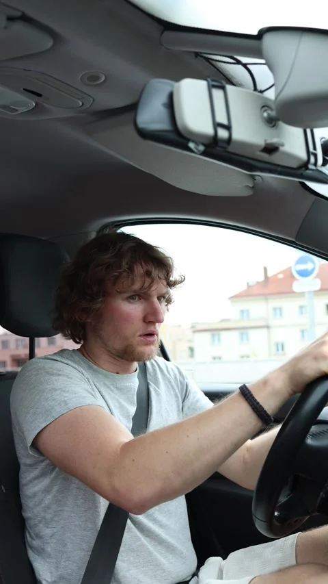 Sleepy driver suddenly wakes and brakes hard after dozing off behind the wheel Stock Footage 342923881