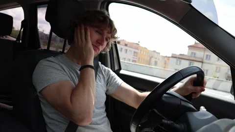 Sleepy driver tries to wake himself up and stay alert on the road Stock Footage 343719975