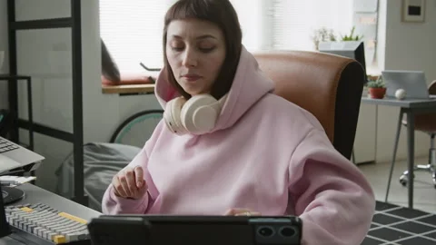 Sleepy Female Programmer Stretching and Siting up in Chair while Writing Code Stock-Footage 335938068