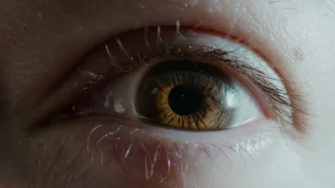 Sleepy lady opens chestnut eye looking into camera in studio Stock Footage 157328310