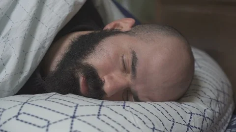 Sleepy Man Goes under Blankets Video stock 88911607
