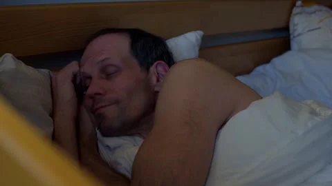 Sleepy man with phone Stock Footage 218113247