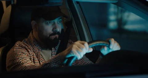 Sleepy man slapping himself while driving Stock Footage 126243976