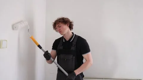 Sleepy painter working almost asleep Stock Footage 335046879