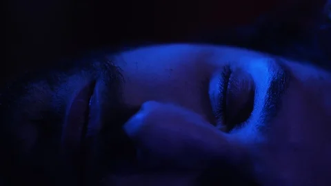 Sleepy young man in bed opening eyes,suffering insomnia and sleep disorder  Stock Footage 103542118