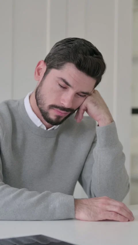 Sleepy Young Man Taking Nap While Sitting in Office, Vertical Video Video stock 339582350