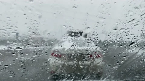 Sleet with rain falls on the windshield of the car. Stock Footage 152548016