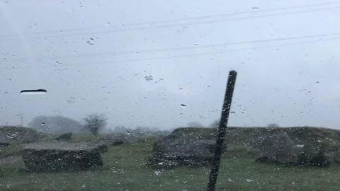 Sleet &amp; Snow on a car windscreen Stock Footage 101979491