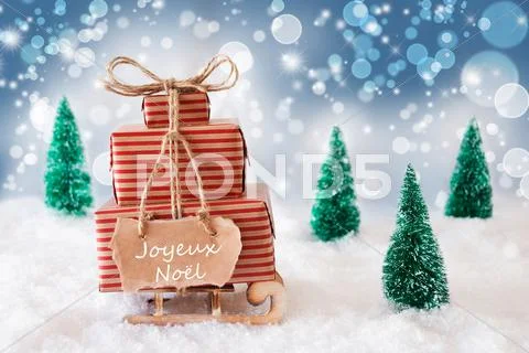 Sleigh On Blue Background, Joyeux Noel Means Merry Christmas Stock Photos
