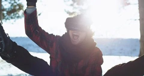 On a sleigh outside closeup charismatic guy using a virtual reality glasses to Video stock 111959415