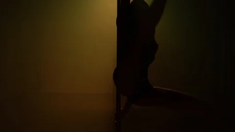 Slender girl carries the elements of pole dance. Stock Footage 127728821