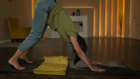 A slender girl does exercises while standing on all fours Stock Footage 152998348