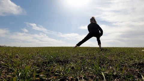Slender girl does a stretch. Stock Footage 127640522