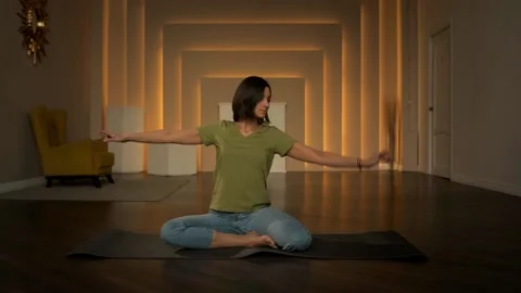 Slender girl doing exercises while sitting. Exercises for pregnant women Stock Footage 152998306