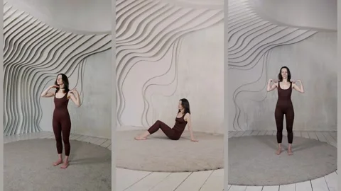 A slender girl teaches posing using the curves of her waist   Stock Footage 313874893