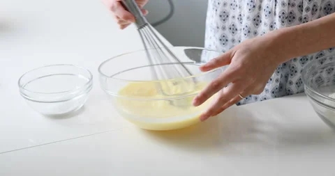 Slender woman's hands work on the preparation of pancakes Video stock 157799874