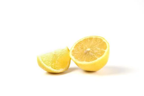 A slice and half lemons isolated on white background Stock Photos