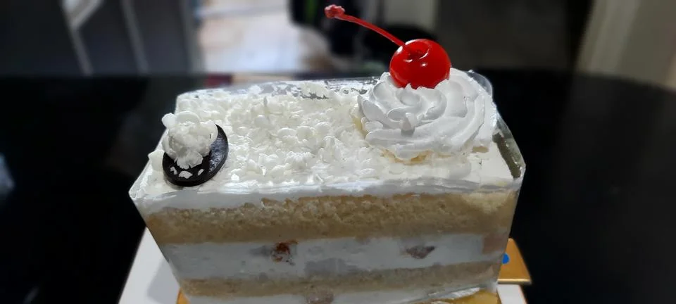 Slice of anniversary cake Foto stock