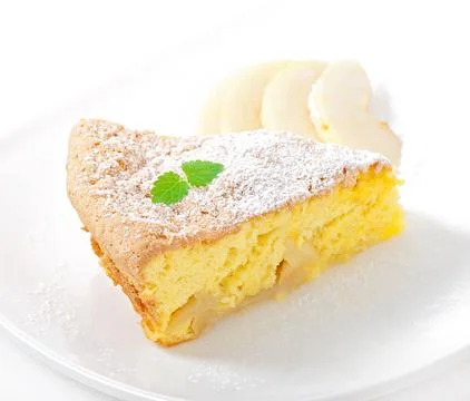 Slice of apple fruit pie on a plate decorated with mint leaf Stock Photos