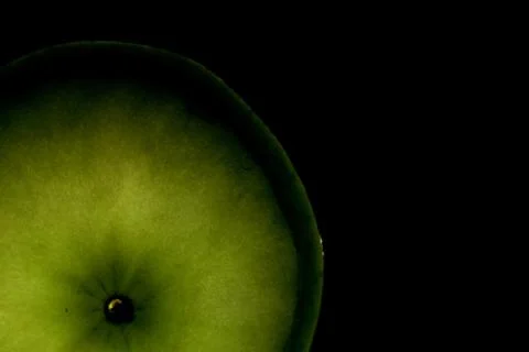 A slice of apple isolated on a black background Stock Photos