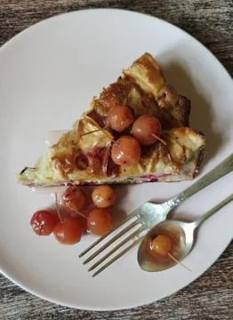 A slice of Apple pie and jam from Paradise apples with a stalk on a light rou Stock Photos