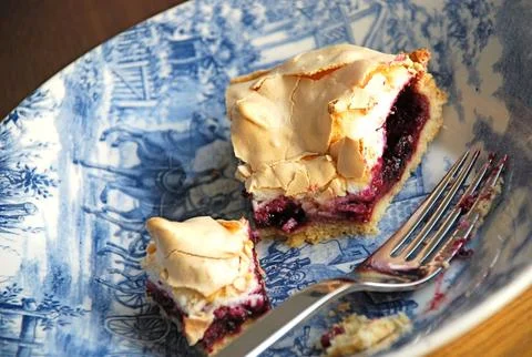 Slice of apple pie on a plate with a piece of cake and a touch Stock Photos