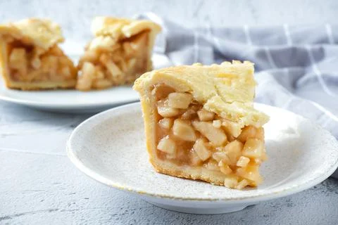 Slice of apple pie in white plate Stock Photos