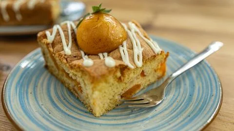Slice of Apricot Cake with Icing Drizzle on Plate Stock Photos