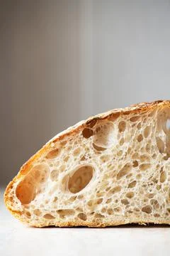 Slice of artisan bread, close up. Stock Photos