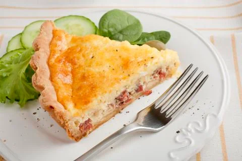 Slice of bacon and egg pie Stock Photos