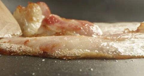 Slice of Bacon on a Frying Pan a Closeup Shot on Red Camera Stock Footage 139007126