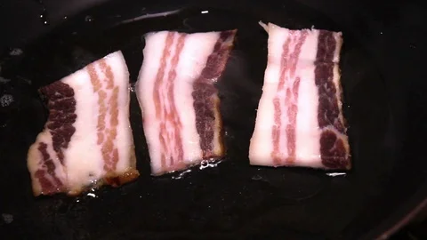 A Slice Of Bacon In Pan Stock Footage 88332091